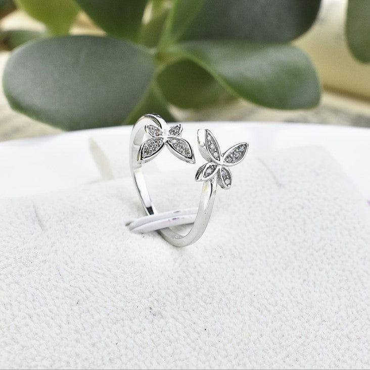 Fly into style with our Sterling Silver Open Butterfly Ring! Made with high-quality sterling silver, this ring features a playful and delicate butterfly design. Perfect for adding a touch of whimsy to any outfit.