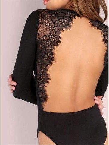 Black lace long-sleeve top worn by a person with a plain background