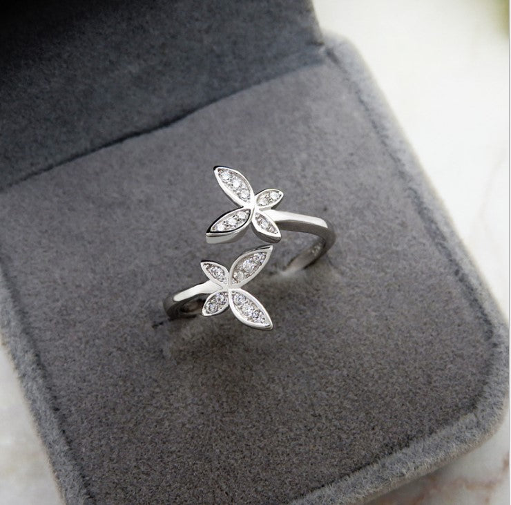 Fly into style with our Sterling Silver Open Butterfly Ring! Made with high-quality sterling silver, this ring features a playful and delicate butterfly design. Perfect for adding a touch of whimsy to any outfit.