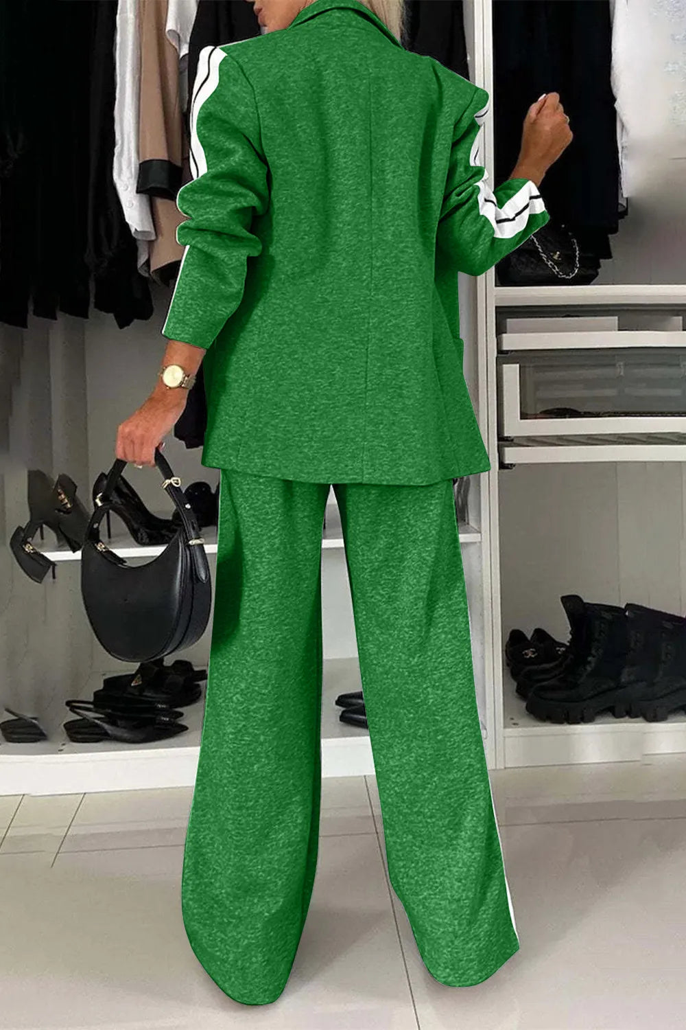Person wearing a green suit in a clothing store setting