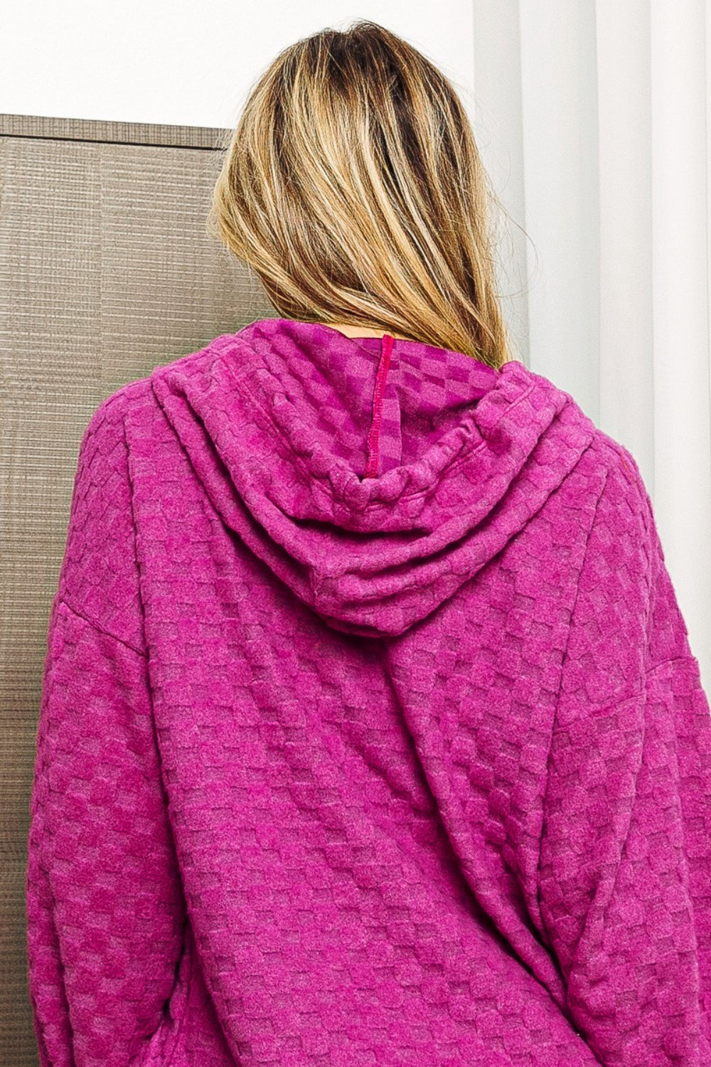 Back view of model wearing a Magenta BiBi Brushed Checker Drawstring Women's Hoodie