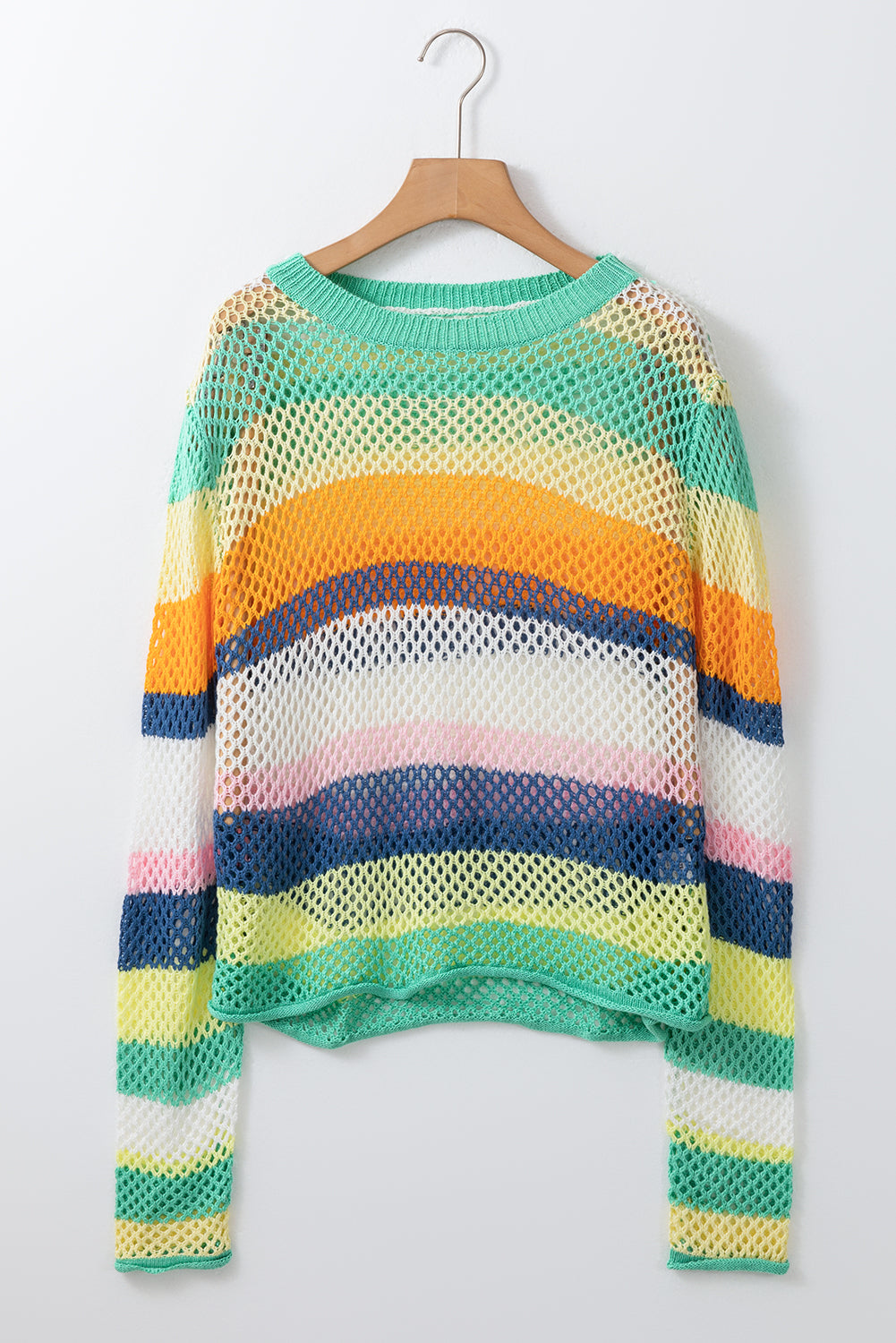 Multicolored striped sweater on a hanger against a white background