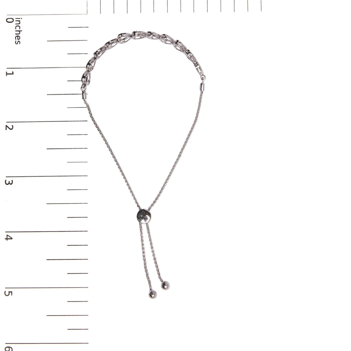 Silver chain necklace with a black bead on a white background with measurement scale.