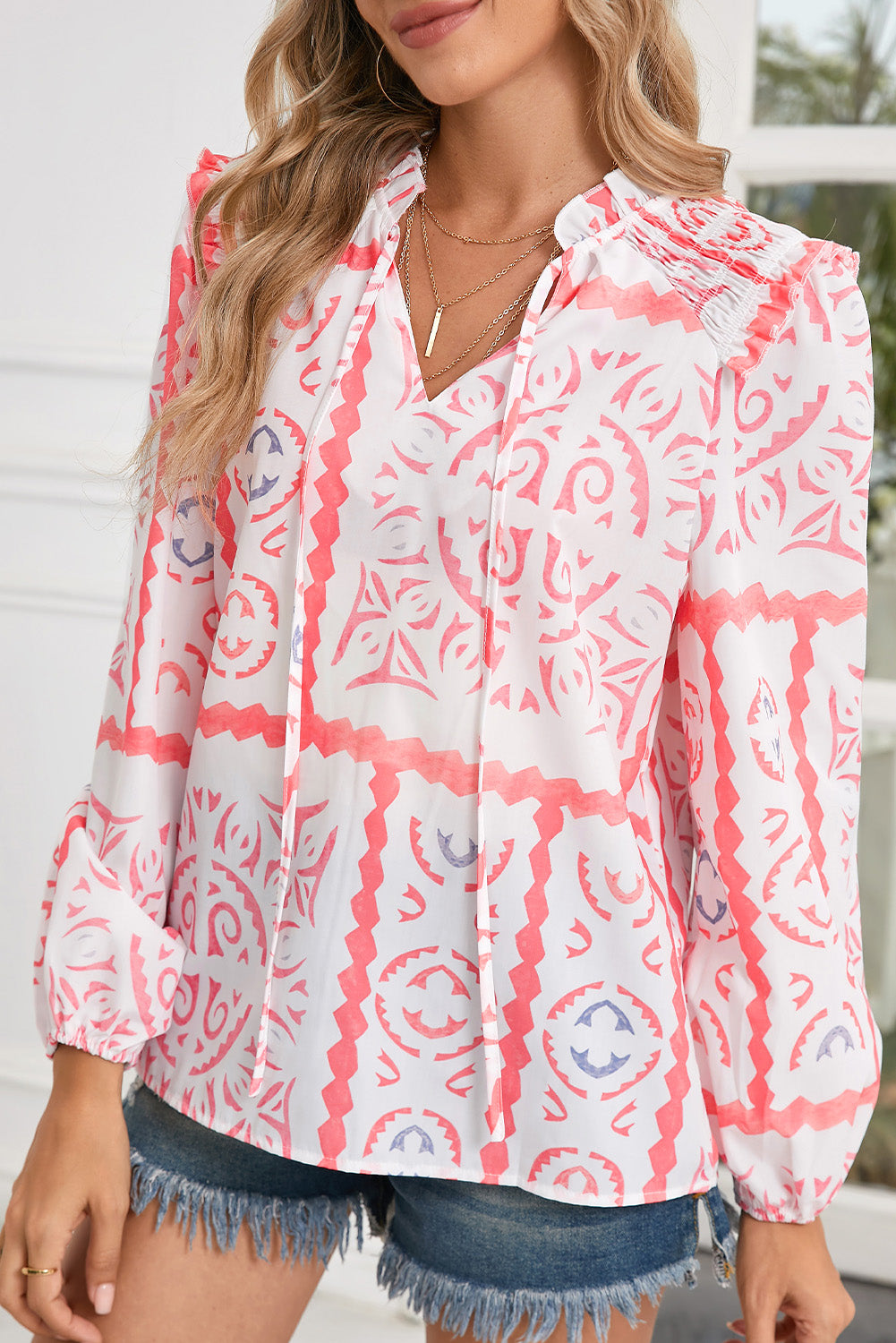 Model wearing a Boho Desert Flower Print V-Neck Smocked Blouse