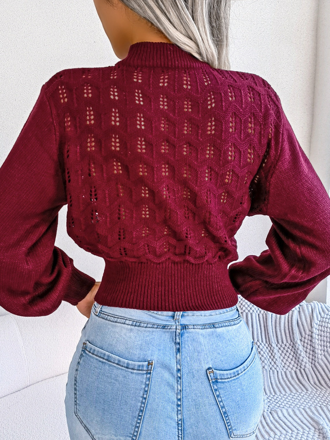 Back view of Women's Exquisitely Contemporary Openwork Mock Neck Cropped Burgundy Sweater