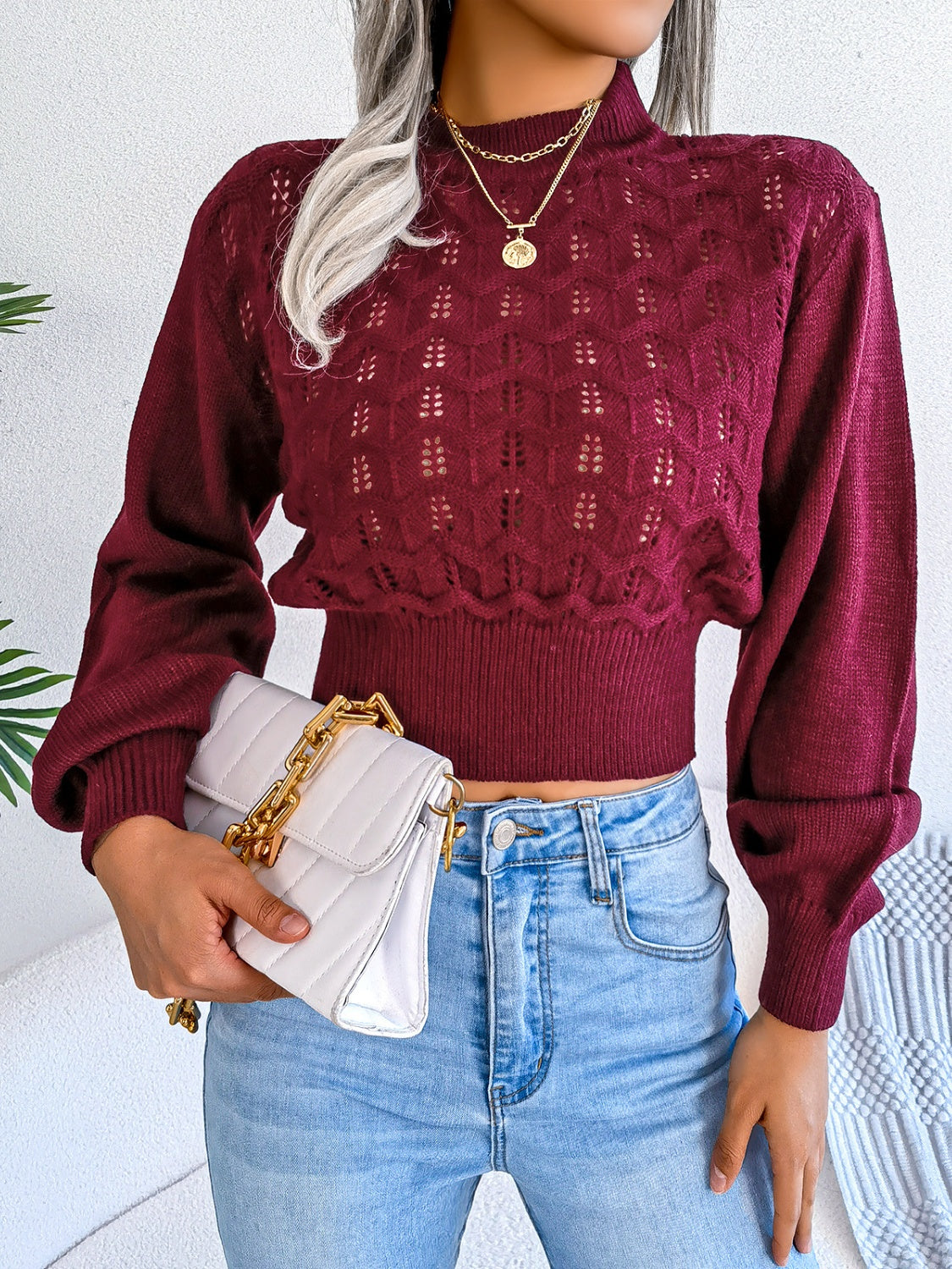Front view of Women's Exquisitely Contemporary Openwork Mock Neck Cropped Burgundy Sweater