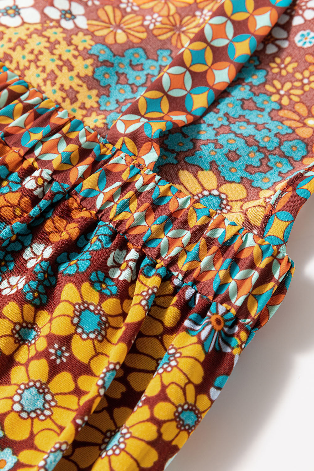 Detail view of a model wearing Retro-Modern Hippie Floral Overalls