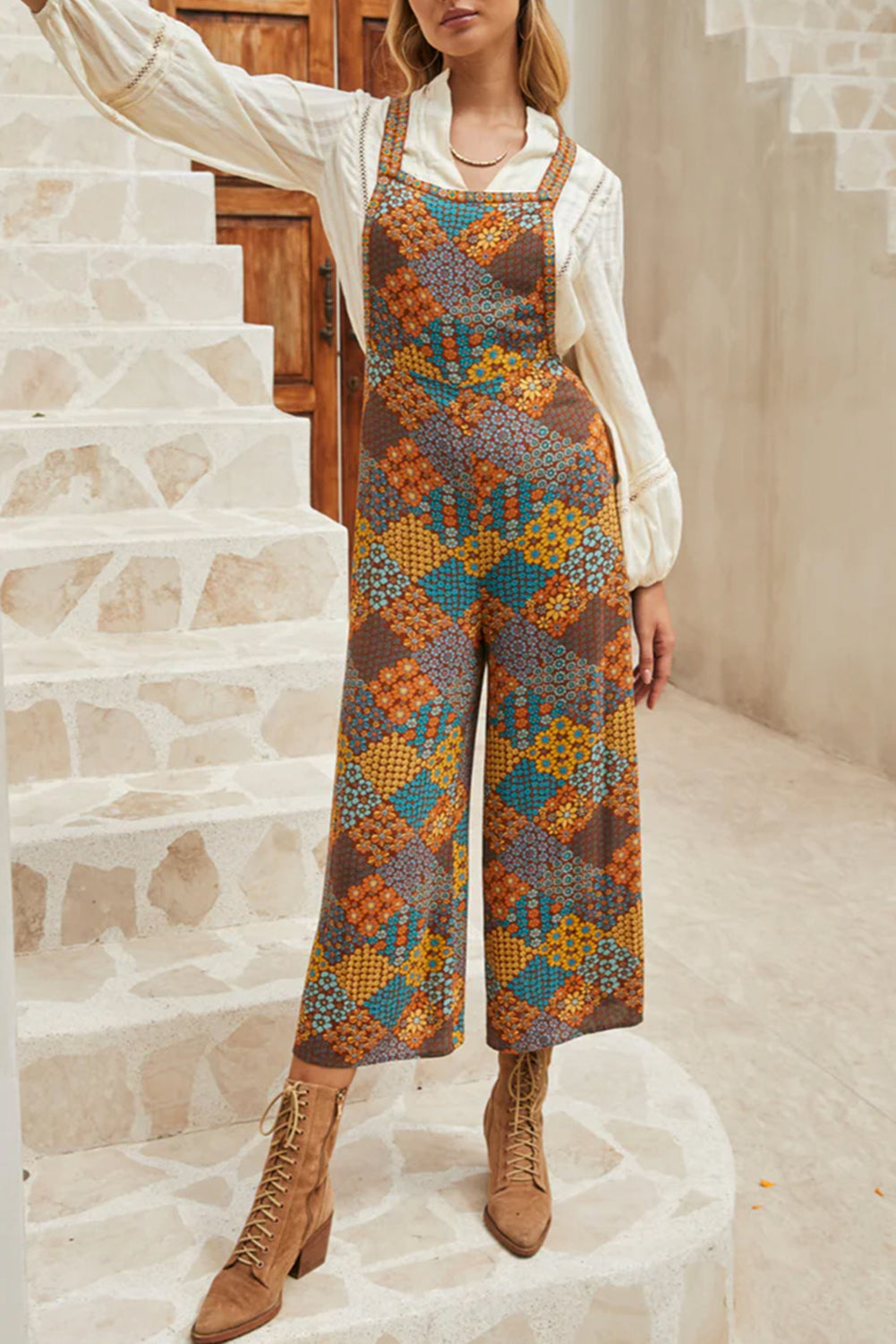 Front view of a model wearing Retro-Modern Hippie Floral Overalls