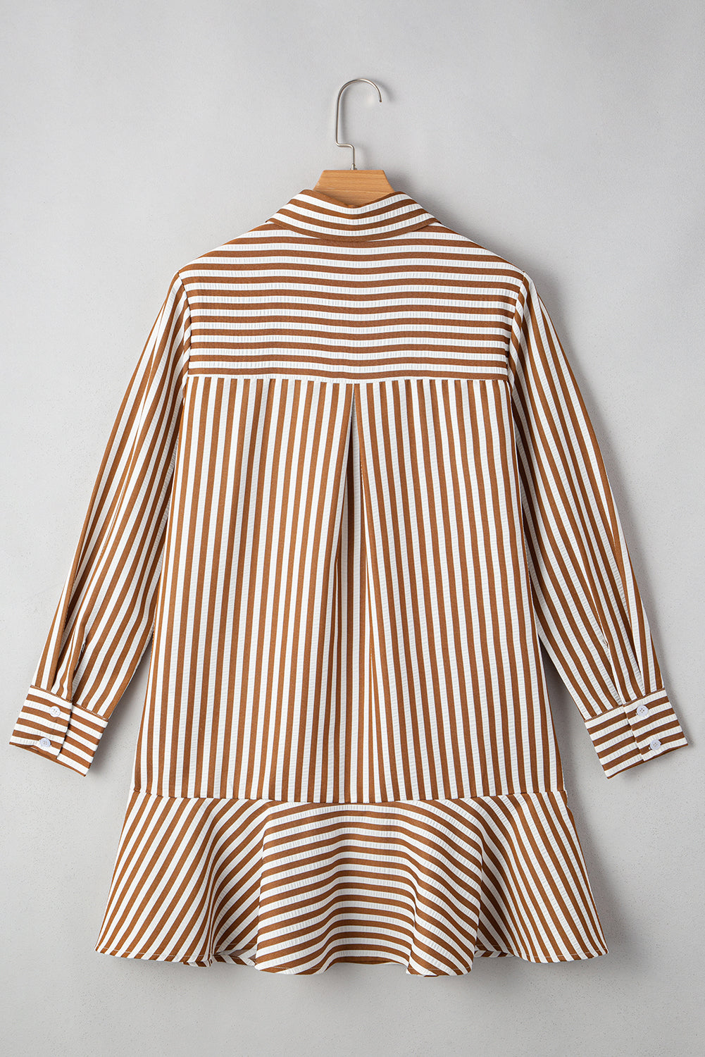 Front view of a women's striped dress featuring a collar, long sleeves, and a flared hem in earthy brown and white colors