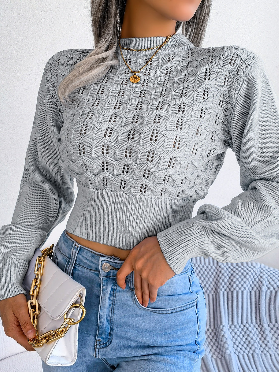 Front view of Women's Exquisitely Contemporary Openwork Mock Neck Cropped Grey Sweater
