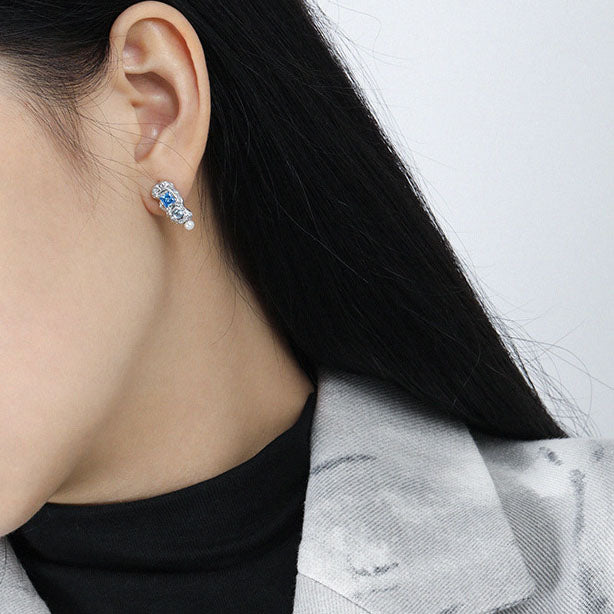 Model wearing Asymmetry Blue CZ 925 Sterling Silver Stud Earrings