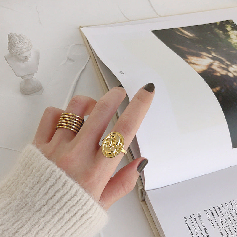 Model wearing gold plated Geometric Ellipse 925 Sterling Silver Adjustable Ring