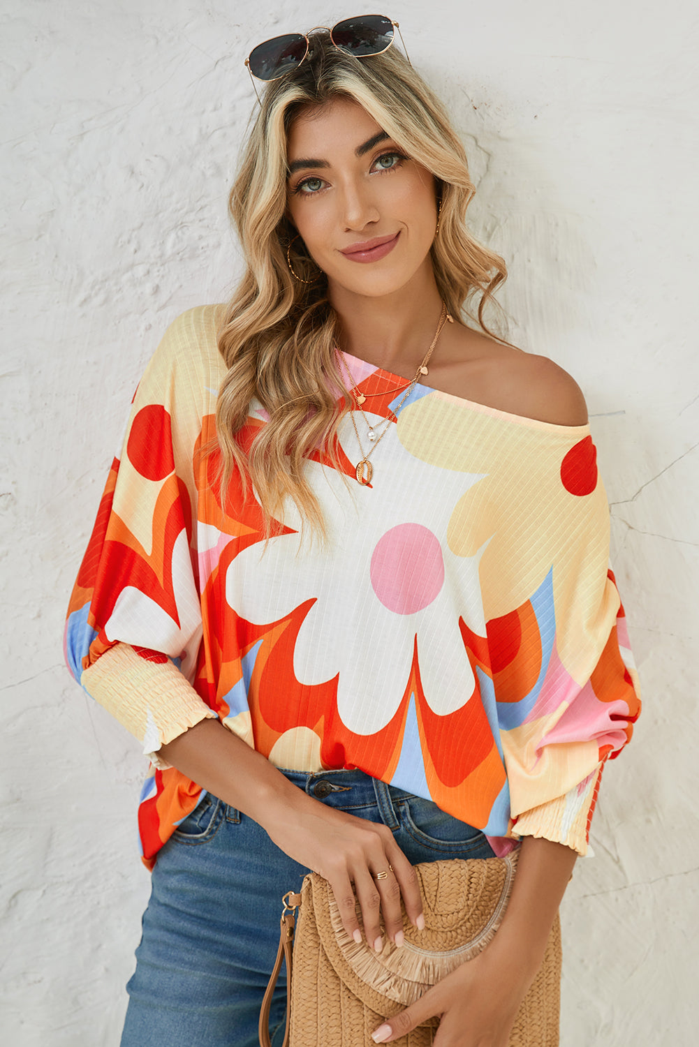 Modeling wearing a Modern Hippie Woman's Colorful Floral Print Ribbed Dolman Blouse off shoulder look