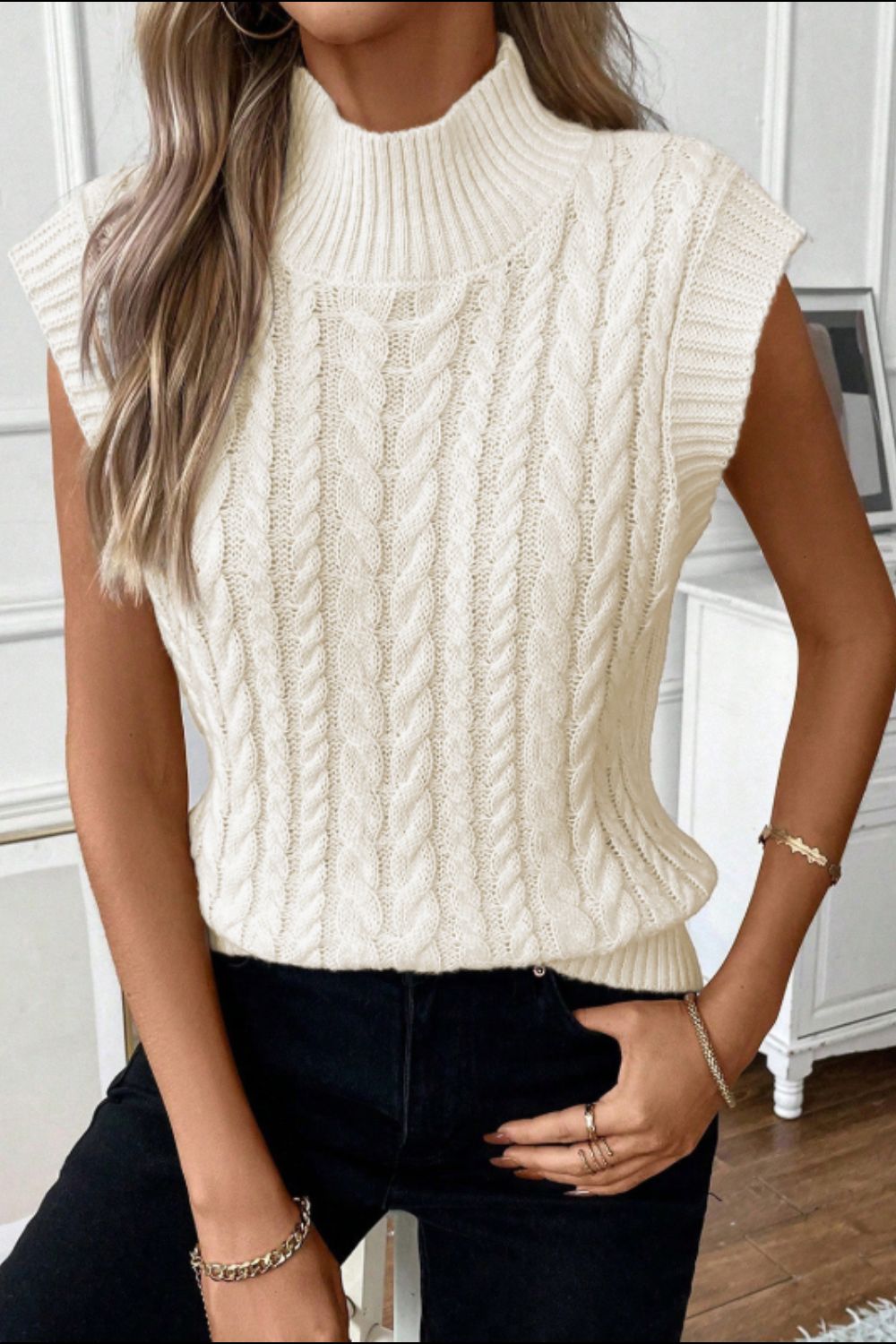 Model wearing a Women's Stylish Cable Knit Ivory Turtleneck Sweater Vest front view
