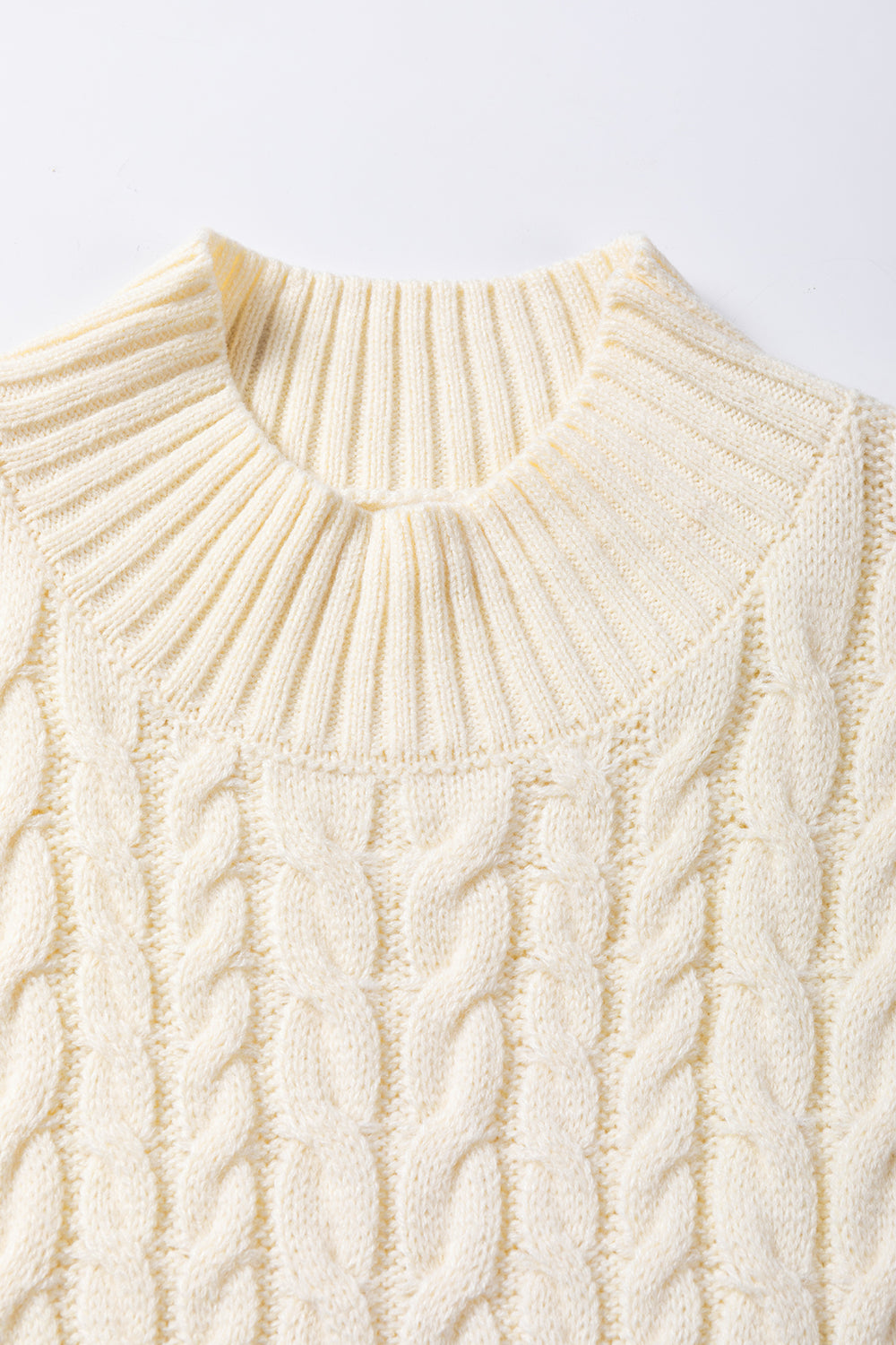 Close-up view of a Women's Stylish Cable Knit Ivory Turtleneck Sweater Vest
