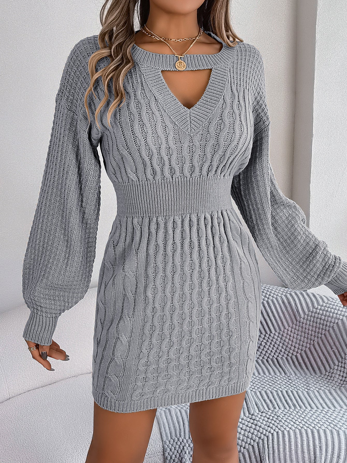 This sophisticated Womens Twist Hollow-out Lantern Sleeve Sweater Dress is crafted from premium, luxurious fabric and features a chic twist on a classic style. Fitted sleeves and a modern lantern hem create an elegant silhouette, while the delicate, intricate hollow-out detailing adds a touch of refinement. Be at the height of fashion with this timeless, effortlessly chic dress.