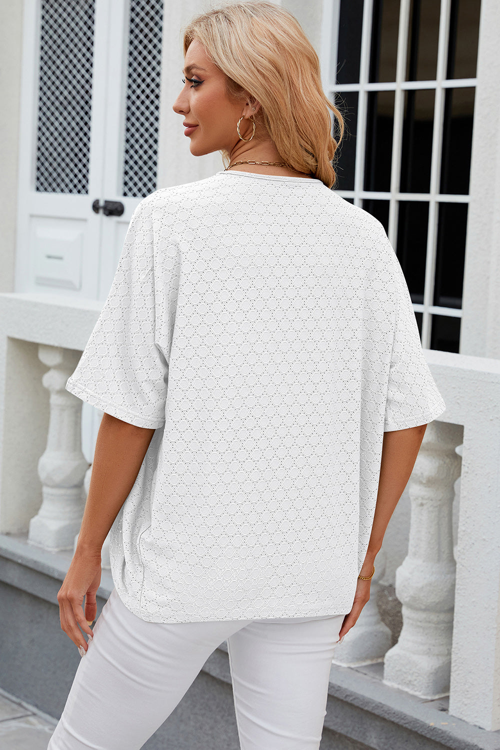 Back view of a model wearing a White Chic Ladies Eyelet Open Front Half Sleeve Cardigan