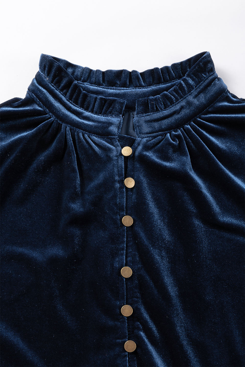 Navy blue velvet dress with gold buttons on a white background
