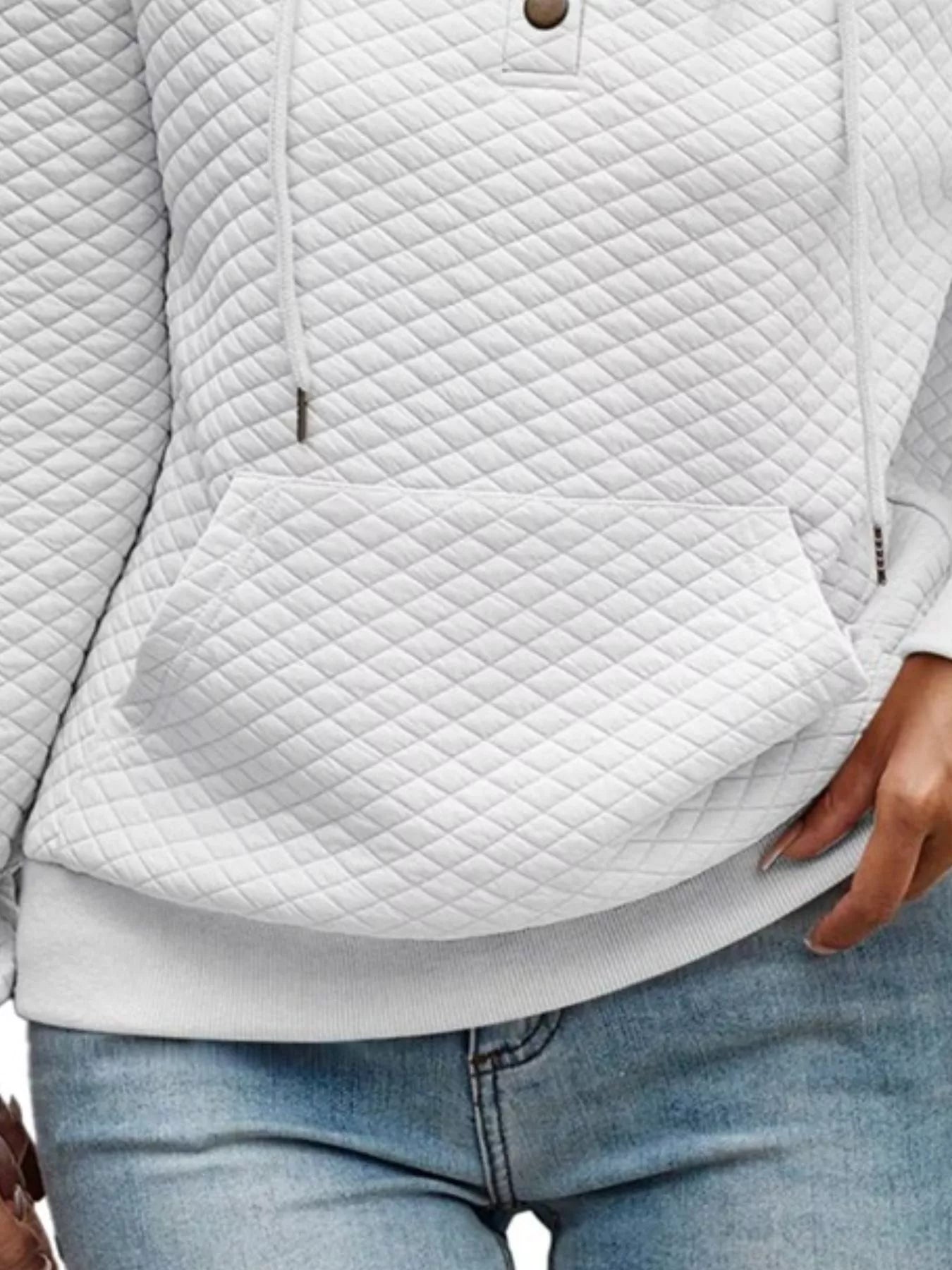 Quilted white jacket worn with light blue jeans