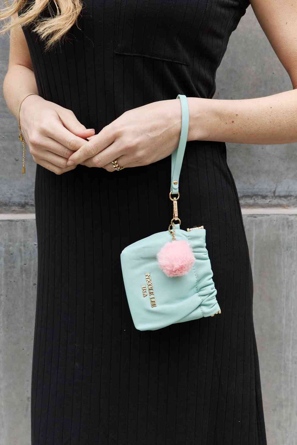 Model wearing Mint Ladies Luxurious Chic Faux Leather Pouch