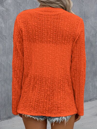 Back view of Model wearing an Orange Contemporary Ladies Eyelet Roll-Tab Sleeve Cardigan