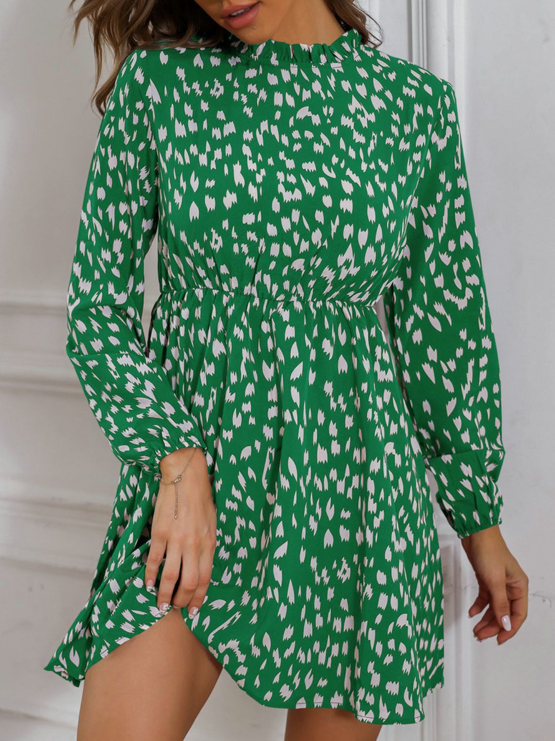 Model wearing a Stylish and Comfortable Green Ladies Printed Frill Neck Long Sleeve Dress