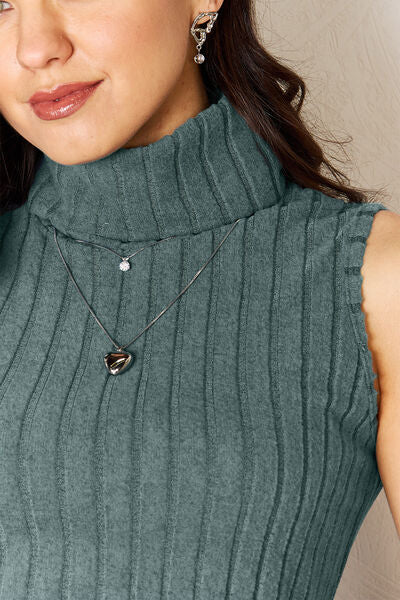Model wearing French Blue Basic Bae Women's Full Size Ribbed Turtleneck Tank close up view