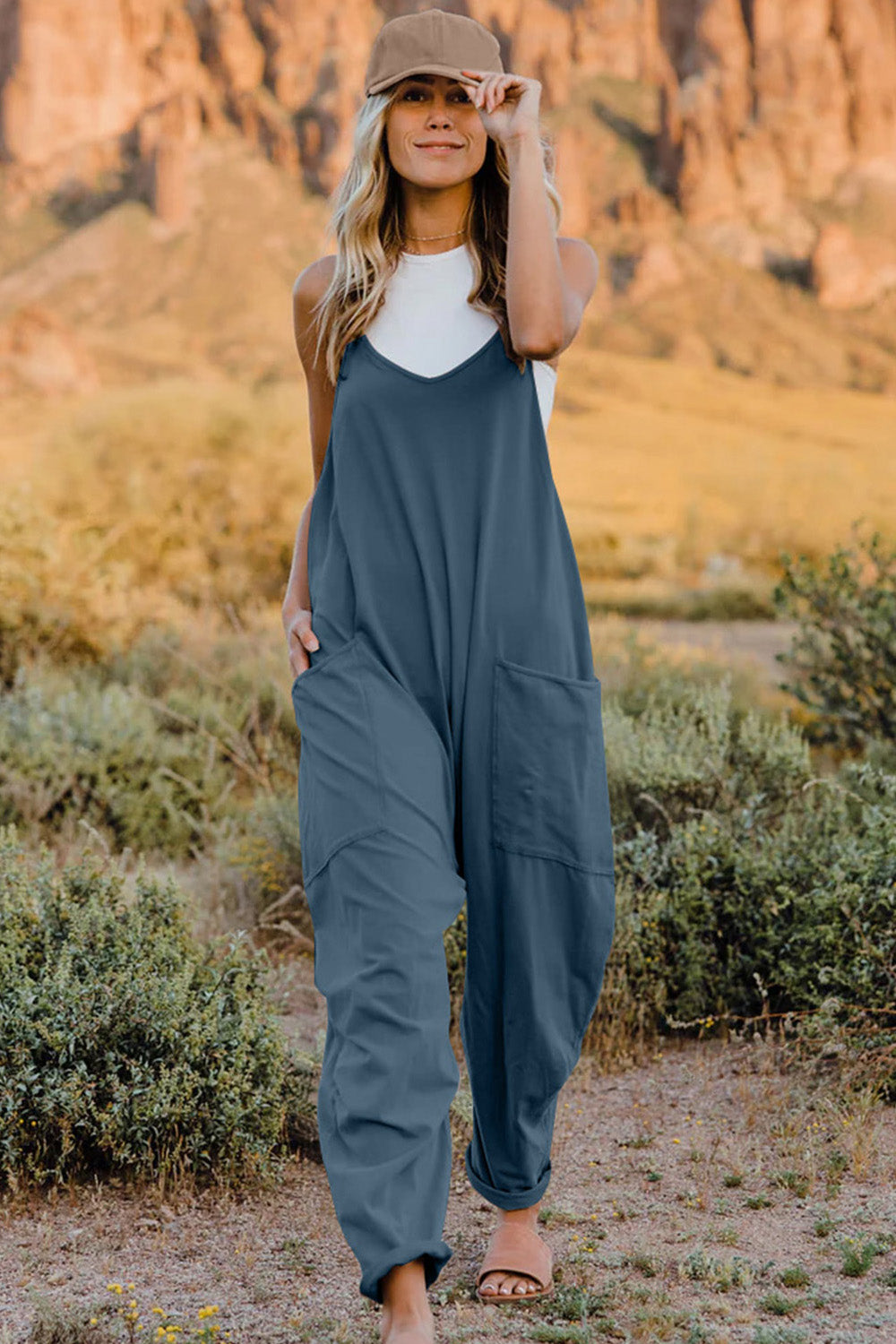This Women's V-Neck Sleeveless Jumpsuit with Pocket is perfect for any occasion! Show off your style with a sleek silhouette while keeping your stuff handy with the pocket. Nothing like looking cool while staying organized!