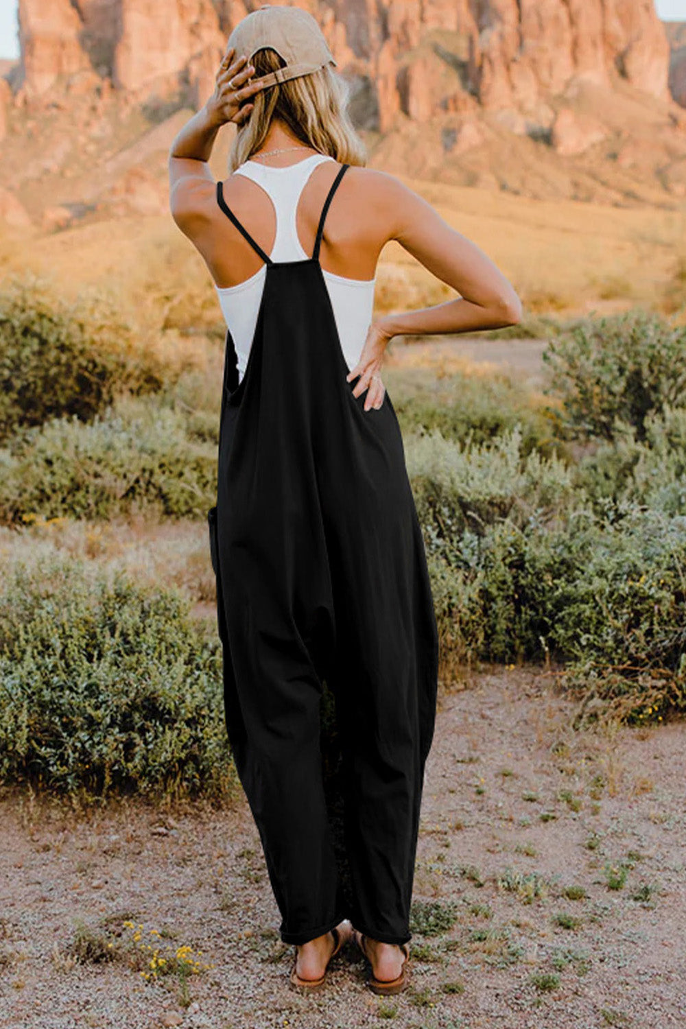 This Women's V-Neck Sleeveless Jumpsuit with Pocket is perfect for any occasion! Show off your style with a sleek silhouette while keeping your stuff handy with the pocket. Nothing like looking cool while staying organized!