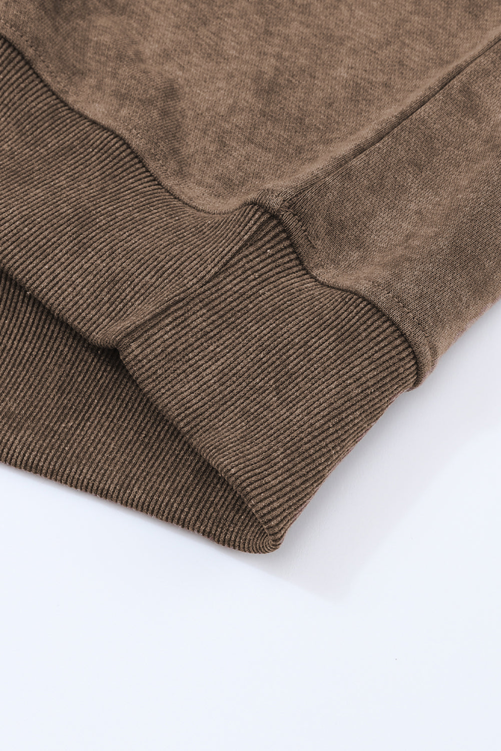 Brown sweater sleeve on a white background