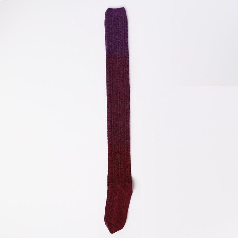Maroon knee-high sock on a white background
