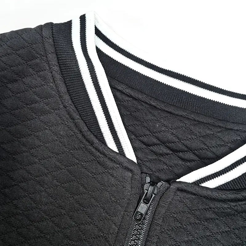 Close-up of a dark gray jacket with white stripes and a zipper on a white background