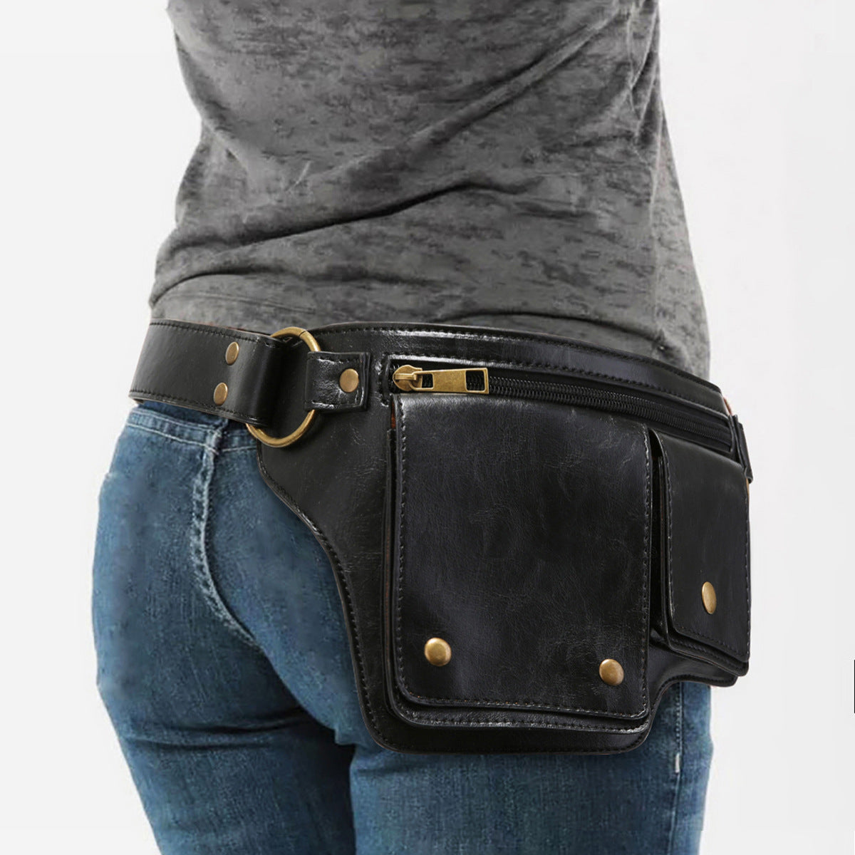 Black leather waist bag with gold accents worn by a person on a white background