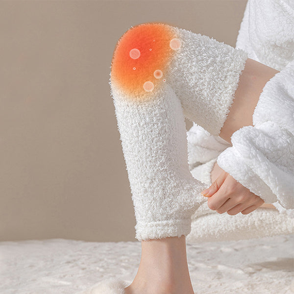 Person wearing white fuzzy pants with a beige background