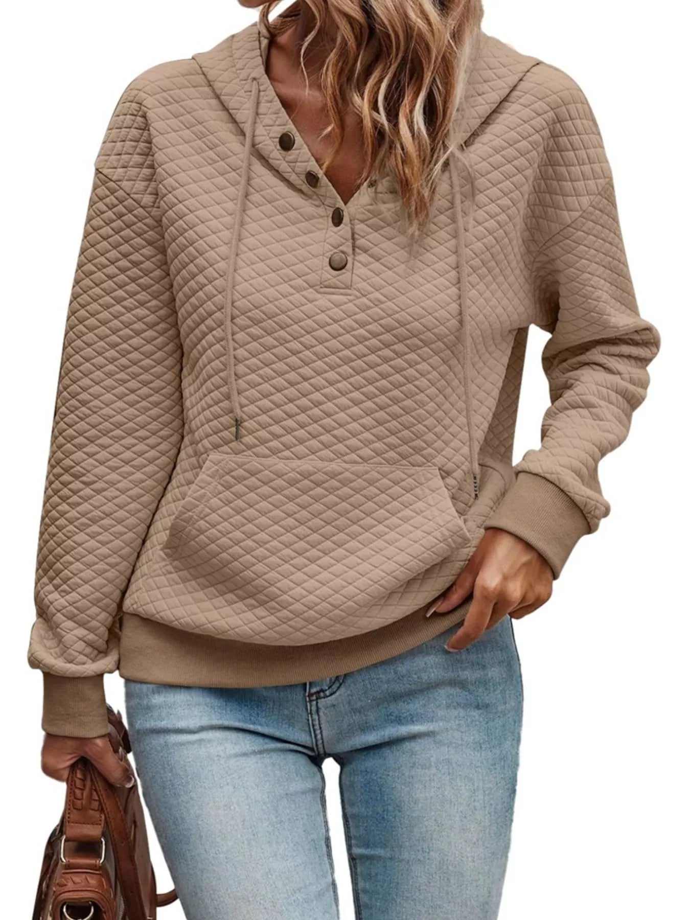 Beige quilted hoodie worn by a person on a white background