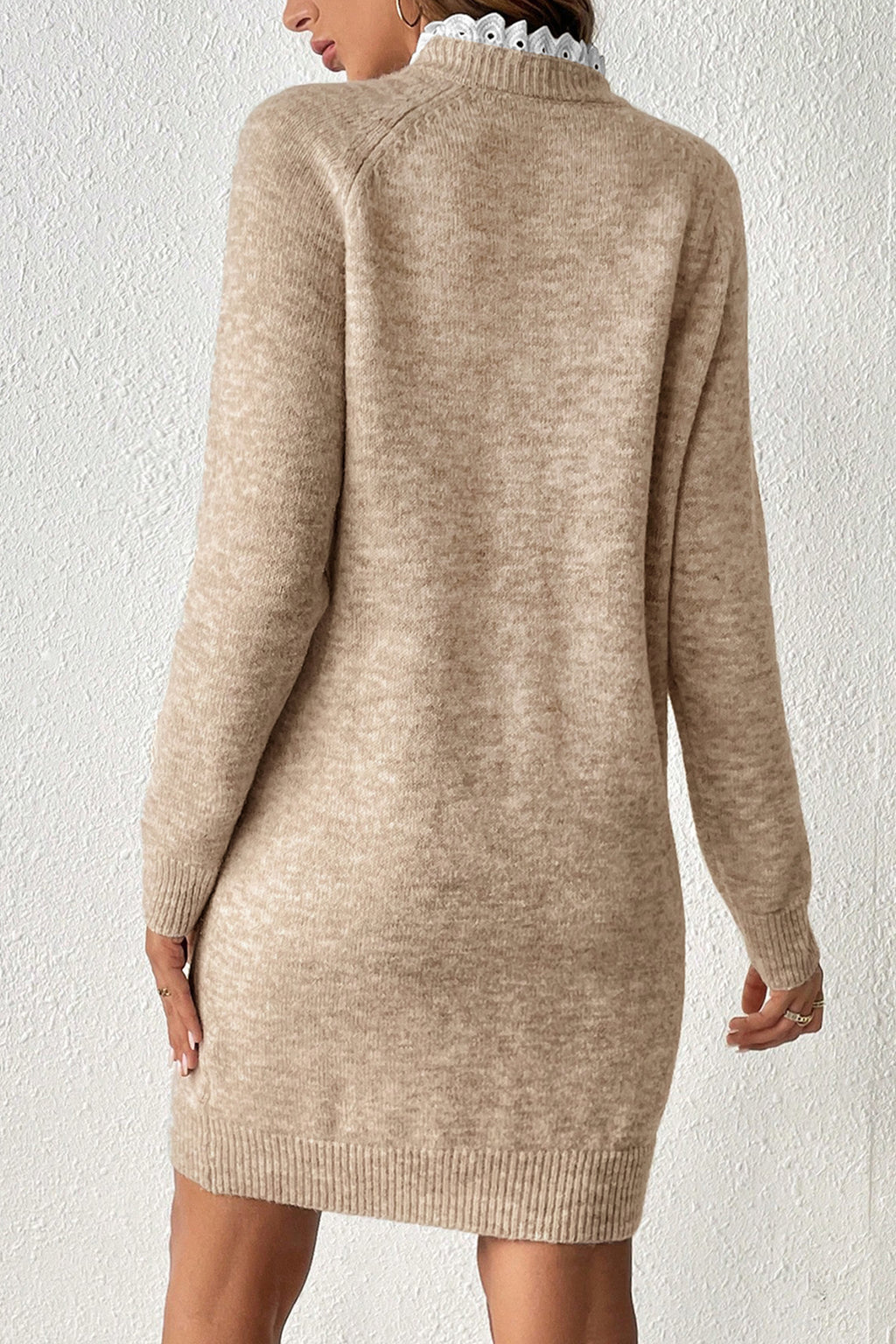  A Beige Cross Shoulder Mini Sweater Dress worn by a model, back view