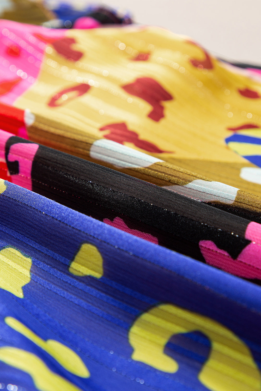 Close-up of colorful children's shoes with cartoon designs.