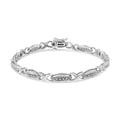 Silver bracelet with intricate design on a white background