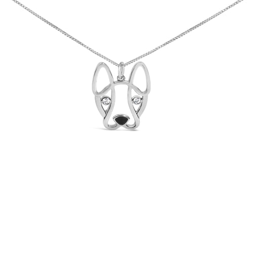 Silver pendant shaped like a dog's face with a black gemstone on a white background