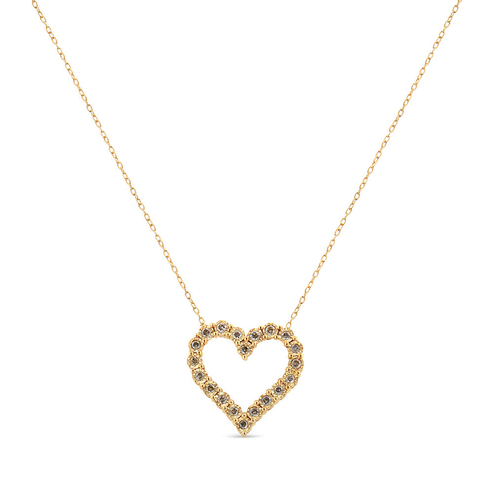 Gold heart-shaped necklace with small stones on a white background