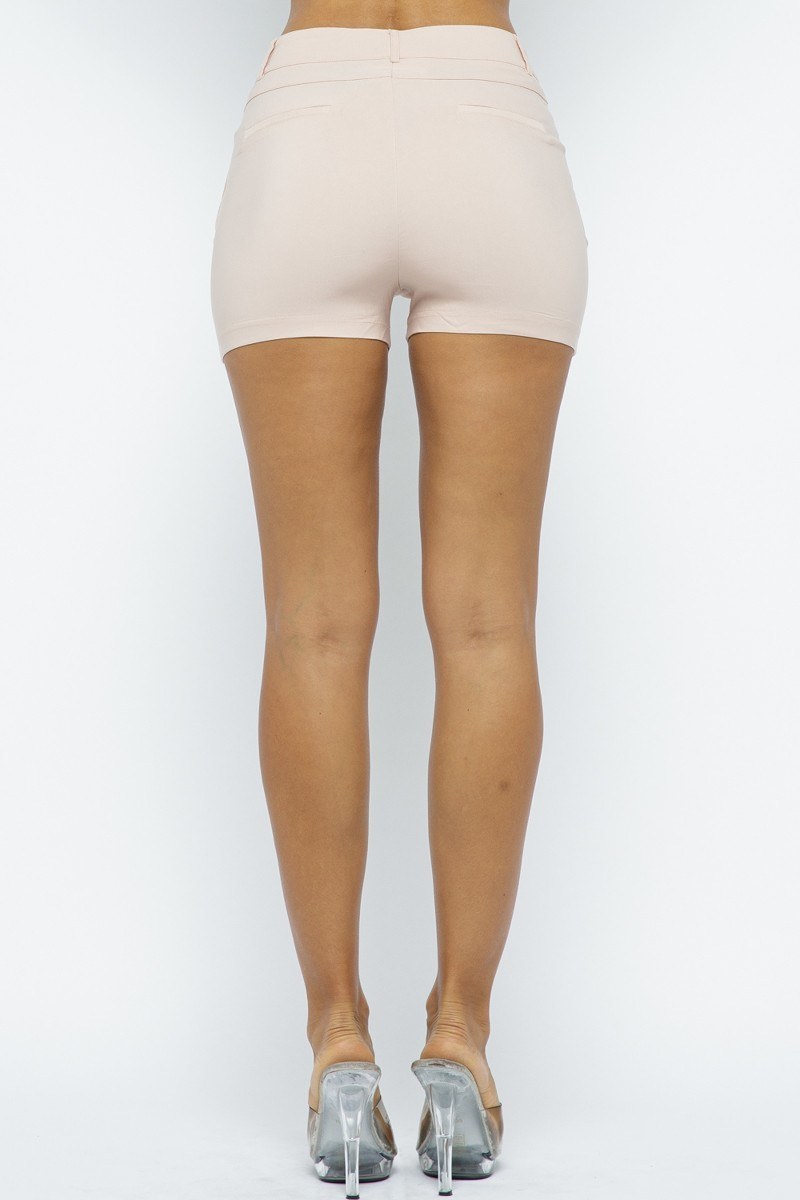 Blush pink shapewear shorts worn by a person on a white background back view 