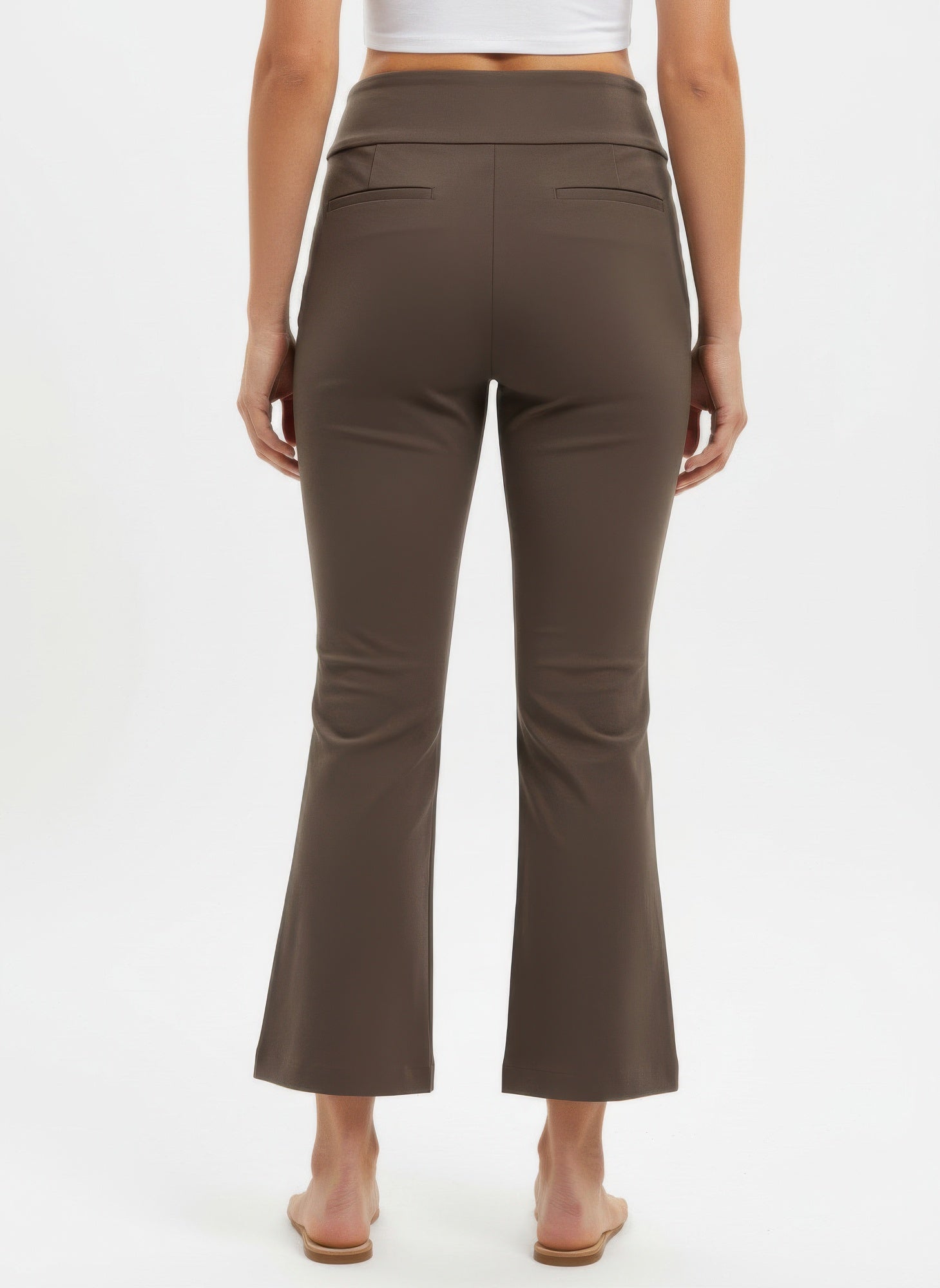 Brown pants worn by a person on a white background back view