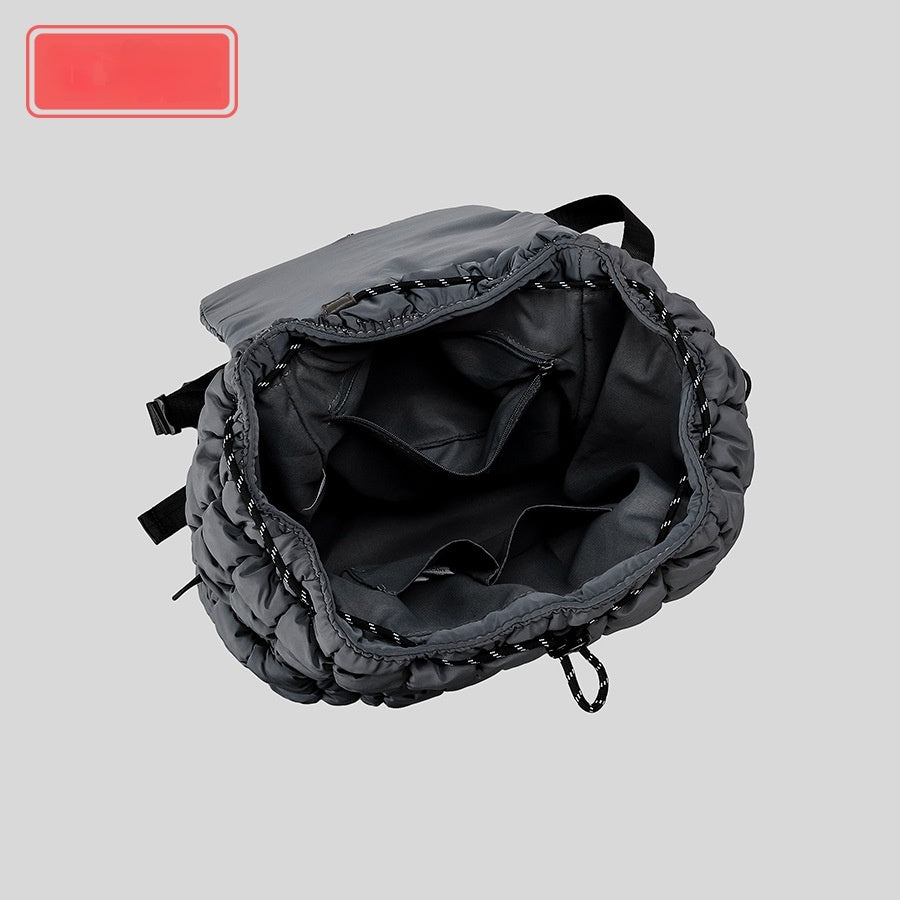 Gray backpack on a light gray background