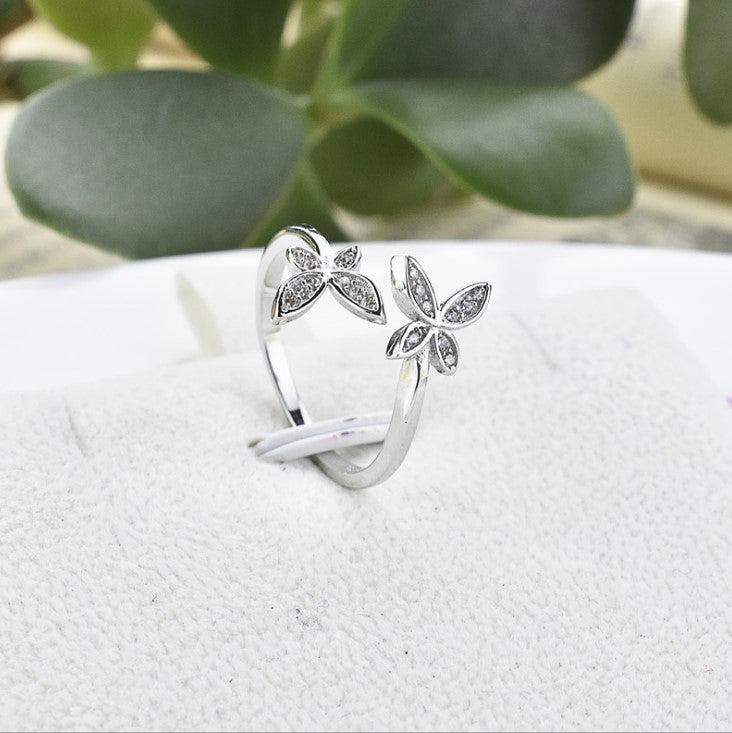 Fly into style with our Sterling Silver Open Butterfly Ring! Made with high-quality sterling silver, this ring features a playful and delicate butterfly design. Perfect for adding a touch of whimsy to any outfit. 
