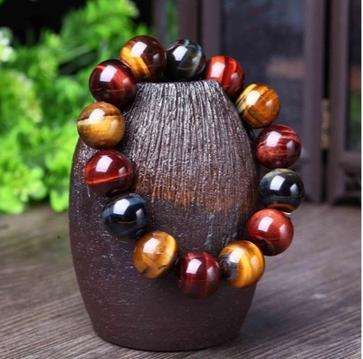 Tap into your courageous side with our Unisex Natrual Tiger Eye Bracelet. Made with natural Tiger Eye beads, this bracelet offers a unique and powerful look for both men and women. Experience the potential benefits of increased courage and confidence while wearing this stylish and natural accessory.