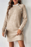 Model wearing a Beige Cross Shoulder Mini Sweater Dress. 