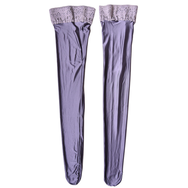 Pair of lavender thigh-high stockings with lace top on a white background