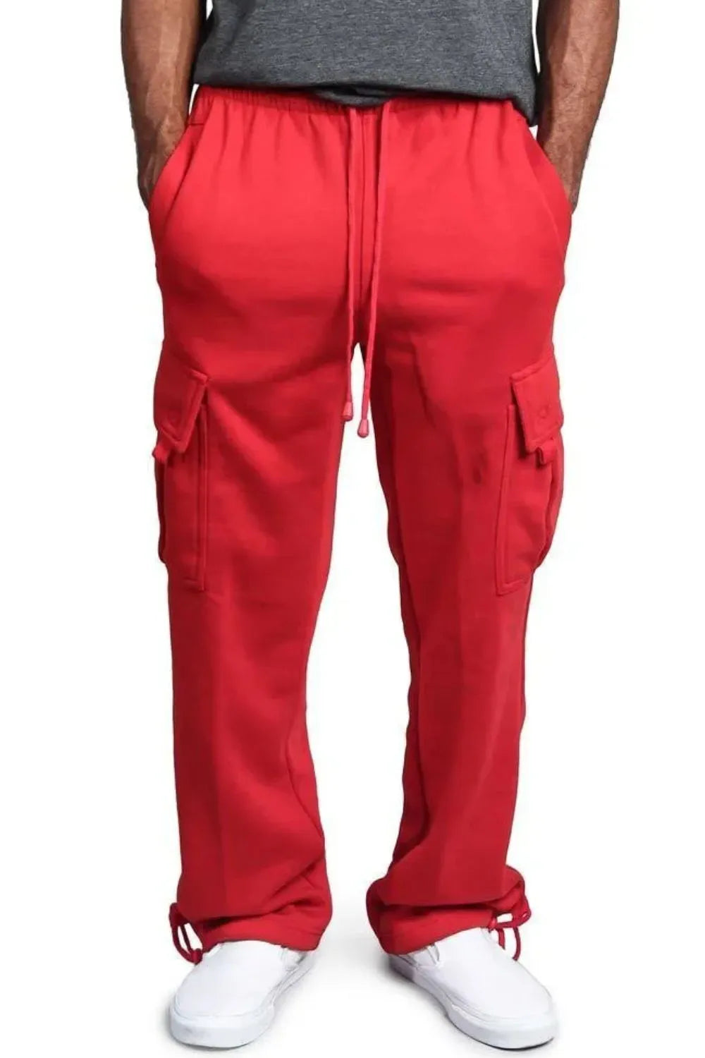 Male model wearing a pair of red casual draw string cargo joggers pants 