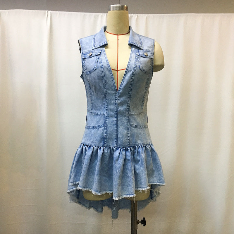 Denim dress on a mannequin against a plain background