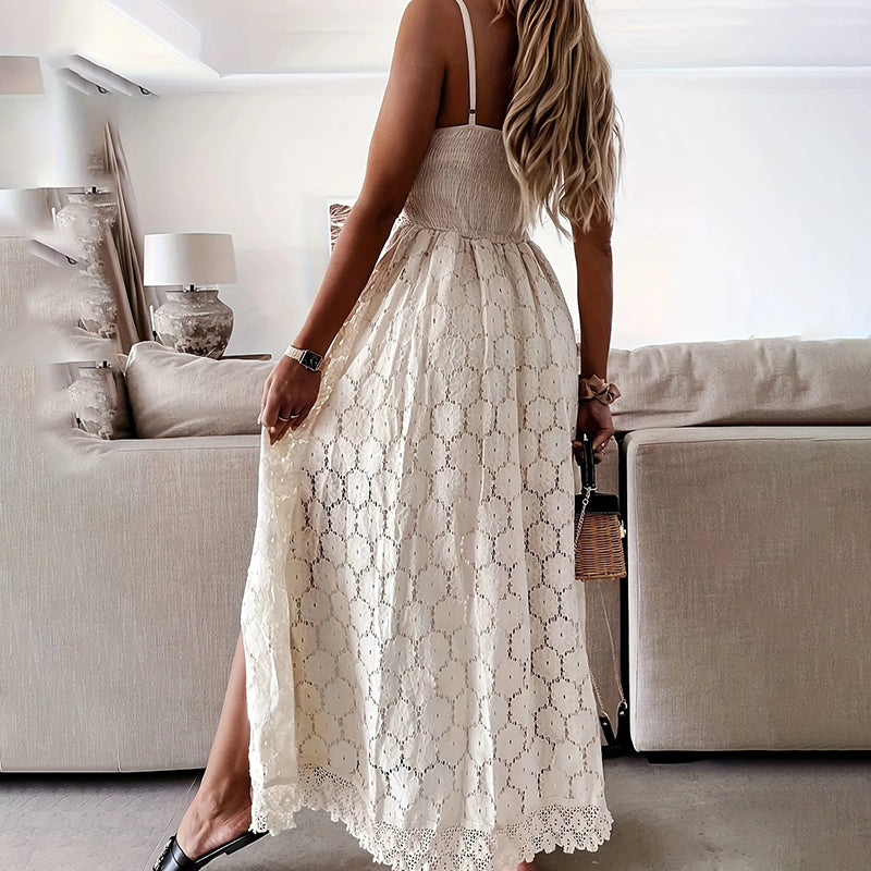 Woman wearing a beige lace dress in a living room setting